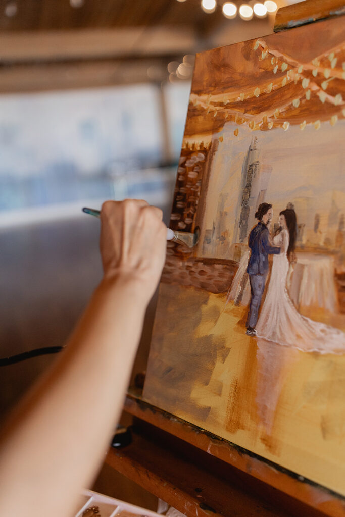 Live wedding painting at Lacuna Lofts - with a view of Chicago Skyline as backdrop